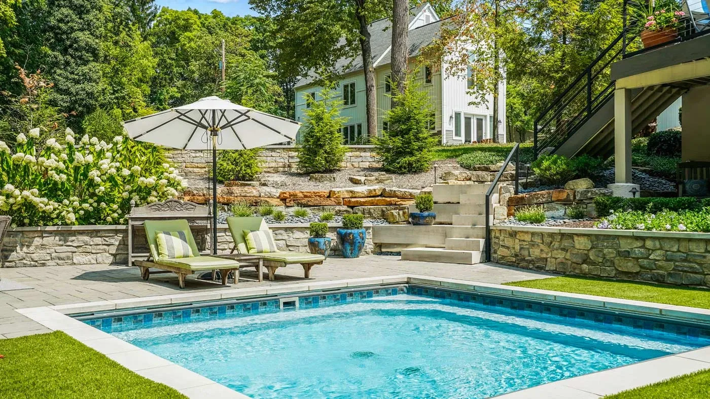 Using Landscaping to Create a Natural Inground Pool Perimeter